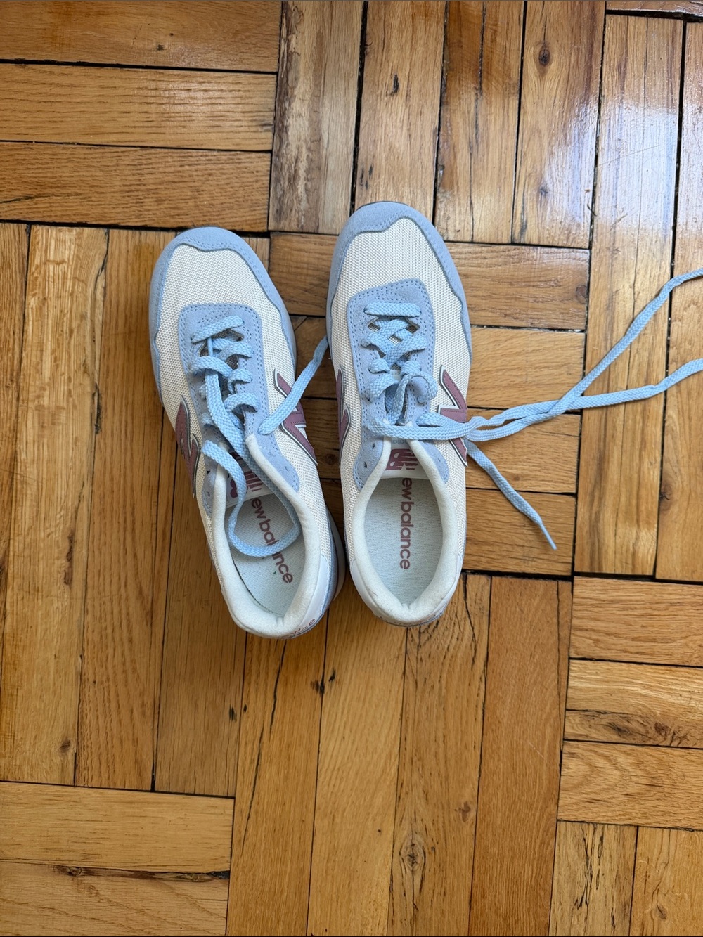 New Balance Light Blue and Cream Sneakers with Pink Logo Accent
